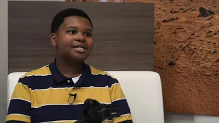 Student Reporter Jaden Jefferson Coaches a Student on Doing an Interview with a Veteran