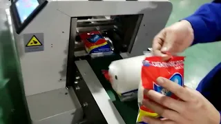 Tape flow packaging machine