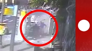 CCTV: Palestinian man with machete attacks Israelis at bus stop