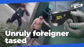 Korean police subdue unruly foreigner