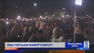 Vigil held for sheriff's deputy fatally shot in ambush-style killing