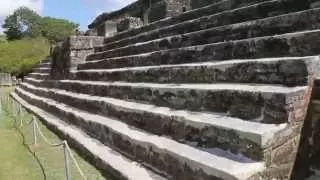 Climbing to the top of the Temple to the Sun God at Altun Ha, Belize