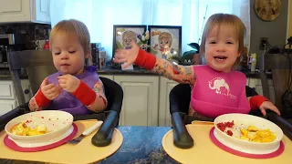 Twins try freeze dried blueberries and raspberries