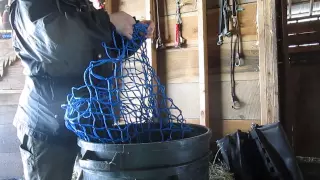 Loading and tying slow feed hay nets for horses