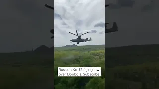 Russian Ka-52 attack helicopter flying low over Donbass. Russia Ukraine war