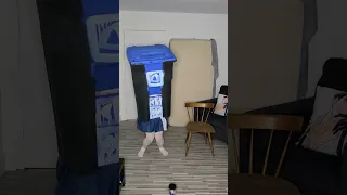 Cosplayer gets in trash can and dances
