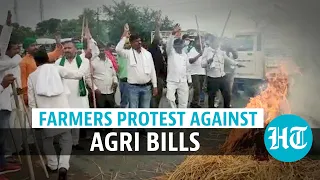 Watch: Tejashwi Yadav drives tractor as farmers block roads & rail tracks