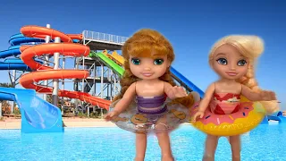 Pool day Elsa and Anna toddlers go on vacation swimming floats barbie doll