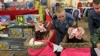 Law enforcement officers participate in Shop with a Cop event