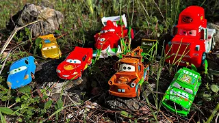 Looking for Disney Pixar Cars On the Rocky Road : Lightning McQueen, Mater, Dinoco McQueen, Mack