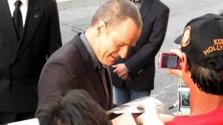 Bryan Cranston of "Breaking Bad" signs autographs for fans at "Total Recall" premiere in Hollywood