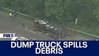 Dump truck flips on side, loses load in Upper Marlboro