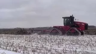 Versatile DT550 pulling a Case chisel plow in the snow