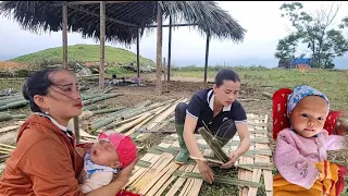 Single mother, with her daughter building a fence, for a house, starting a new life