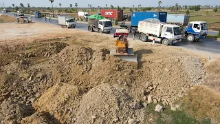 New Update Filling Land Using Dump Truck Unloading Stone, bulldozer Push Stone Next to National Road