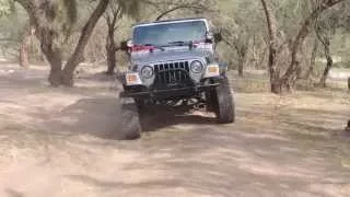 crazy jeep 4x4  with helicopter fly over.