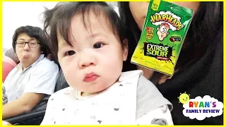 Twin Babies first airplane ride and Kid Warheads Sour Candy Challenge