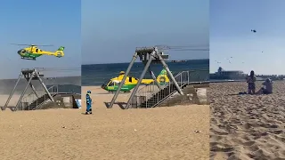 Ambulance helicopter takes off from incident site at Bournemouth Beach
