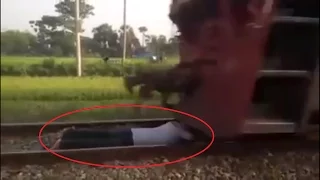 Extremely Insane - Bangladeshi Boy Lays Under a Speedy Train!!! Not for weak heart peoples!!