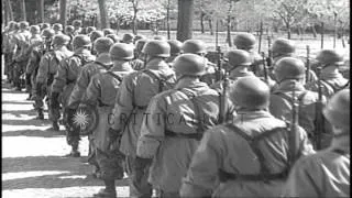 German soldiers march on a street in Germany during World War II. HD Stock Footage