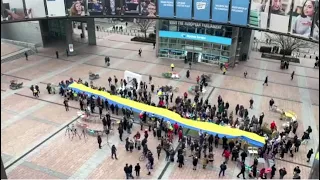 Giant Ukrainian flag unfurled at EU Parliament for invasion anniversary