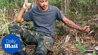 Man tries to escape being bitten by a rattlesnake
