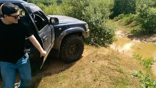 Toyota Hilux surf playing in a mud bog