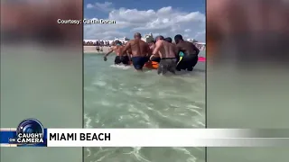 Video shows beachgoers helping injured after helicopter crash