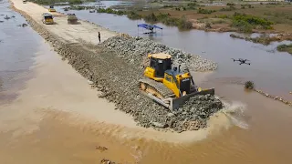 Urgent Work Build Road Fighting the flood by Team Operator Dump Truck , Bulldozer Work actively