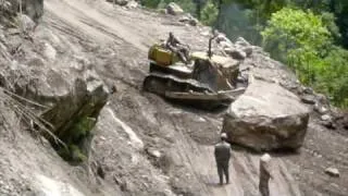 Pushing boulder off the road