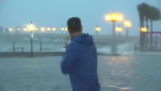 Two hours ahead of high tide, flooding pours over seawall in St. Augustine