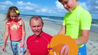 Katy and Max play on the Beach with Daddy