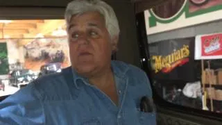 Riding with Jay Leno, in his antique electric car