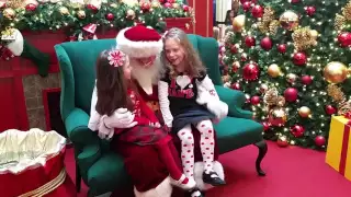 Santa Max sings Happy Birthday to the girls.