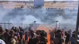 Crowds sprayed with burning fuel at a drag racing event