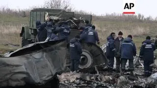 Recovery workers began collecting debris from the MH17 crash site in eastern Ukraine on Sunday. (Nov