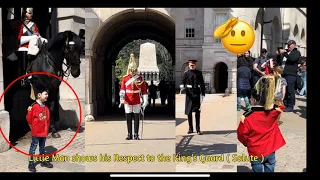 Little Boy Dressed up as a King’s Guard, Salutes to Soldier at Horse Guard Parade.