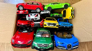 Box full of various miniature cars Jaguar, Peugeot, Renault, Hyundai, Mazda, Volvo, Honda, Opel #515