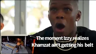 The Moment Israel Adesanya realizes Khamzat Chimaev won’t take his belt.