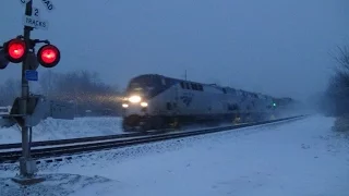 Amtrak in Snowstorm with Winter Park Express Wrap Ad