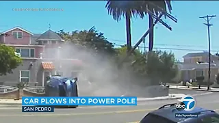 Video: Car plows into power pole in San Pedro, narrowly missing intersection crash l ABC7
