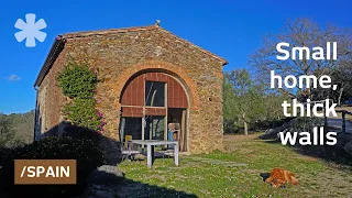 Turns stone barn into Minimal home with hidden furniture-rooms