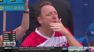 Joey Chestnut eats 62 hot dogs in 10 minutes at dog eat dog competition