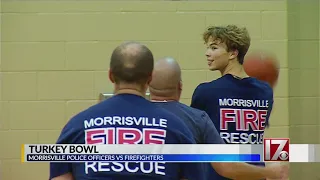 Morrisville police take on firefighters to help the needy at Thanksgiving