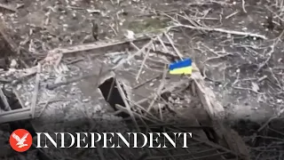 Ukraine flag flies on building after village of Robotyne captured from Russia