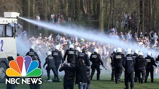 Belgian Police Clash With Crowds At Non-Existent Music Festival | NBC News NOW