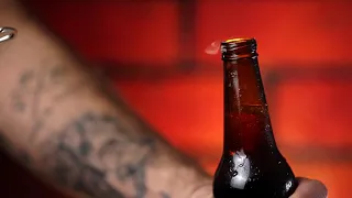 Opening a beer bottle | Free Stock Video.