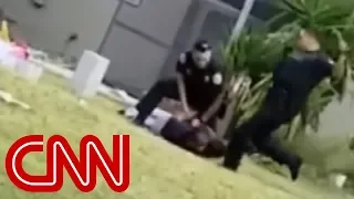 Cop kicks handcuffed suspect in the head