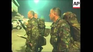 UK troops arrive in Pristina, night time burning houses