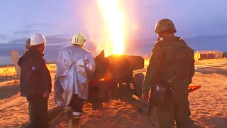 The gun MT-12 "Rapier" knocks the flame on a gas well under the New Urengoy